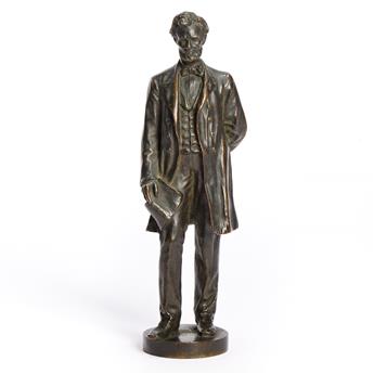 (ABRAHAM LINCOLN.) George E. Bissell, sculptor. Statuette of Lincoln standing with the Emancipation Proclamation.